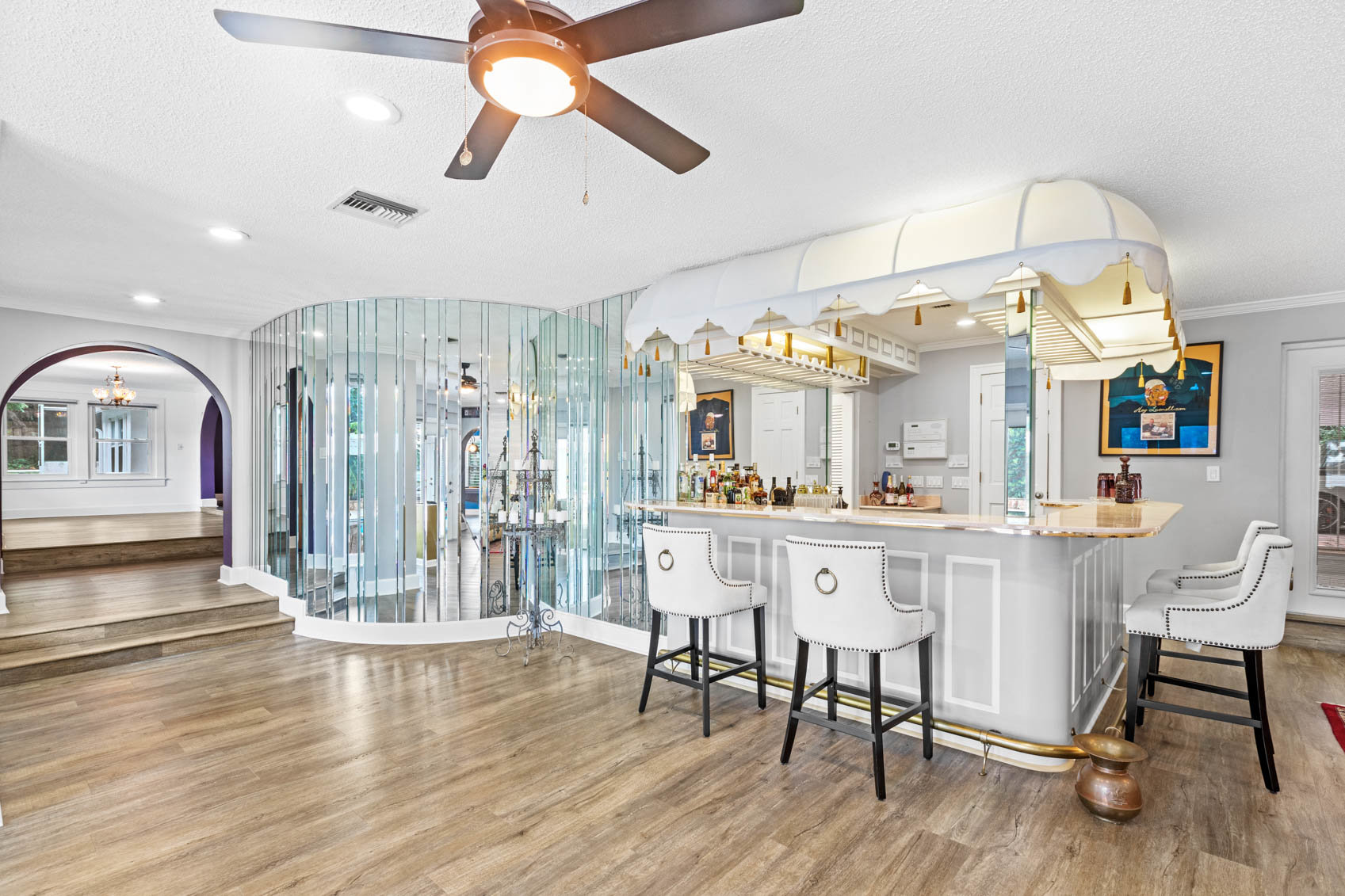 bar in living room with glass decor
